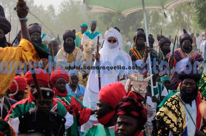 The Emir of Kano, Nigera, Ado Bayero (center), surrounded by his traditional palace guards