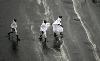 Next picture :: Muslim pilgrims run for cover as heavy rain streams down a road in the holy city of Mecca