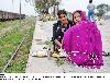 Next picture :: Sikh women eat at platform of Wagah Railway station.