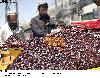 Customers purchasing dates from a vender for Iftari in Quetta