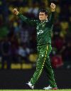 Saeed Ajmal raises his arms after picking up a wicket
